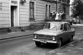 Black and White Photo of Car Transporting Mannequins