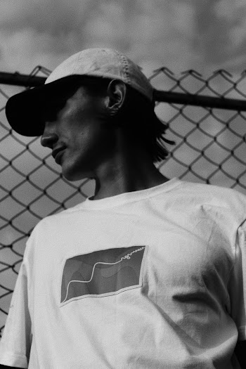Black and White Photo of Man Wearing Cap