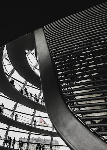 Black and White Photo of People Inside Building