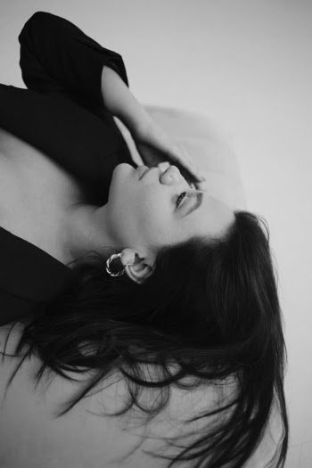 Black and White Portrait of Woman Laying Down · Free Stock Photo