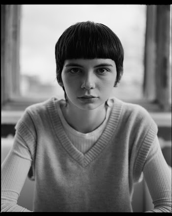 Black and White Portrait of Woman Looking at Camera with Neutral Expression · Free Stock Photo