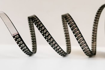 black and white strap on white surface