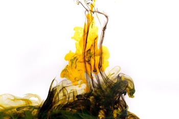Black And Yellow Ink Streams Upwards