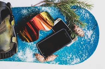 black Android smartphone on top of silver Android smartphone