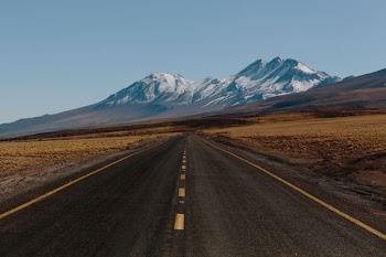 black asphalt road and mountain landscape