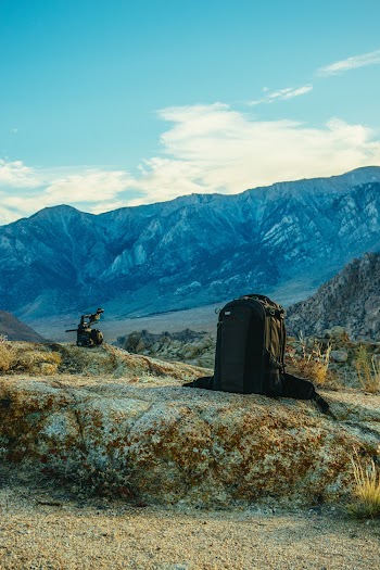 Black Backpack on a Rock