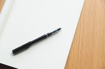 Black Ballpoint Pent on White Ruled Paper