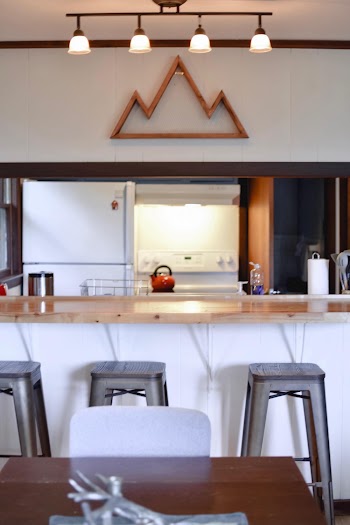 Black Bar Stool Near Bar Inside Well-lit Room