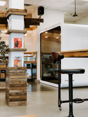 Black Barstool Beside Wooden Table