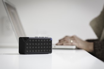Black Bluetooth Speaker on White Table