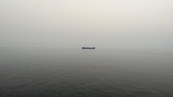 black boat on body of water