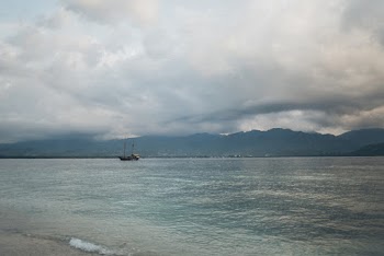 Black Boat on Body of Water