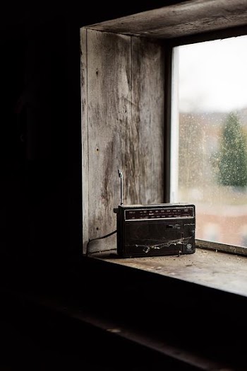 black boombox radio on top window