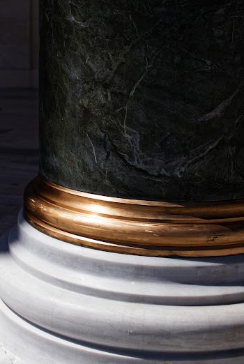 Black, Brass-colored, and White Pillar