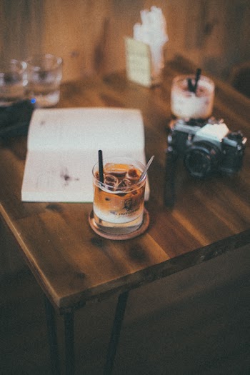 Black Bridge Camera Near Drinking Glass