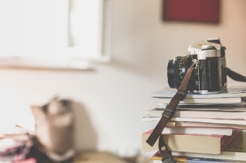 Black Bridge Camera on Top of Piled Books