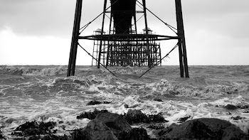 Black Building Structure in the Middle of Body of Water