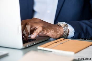 Black businessman using a laptop