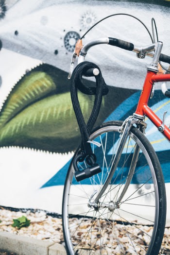 Black Cable Lock Hanged on Gray and Red Bike