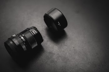 black Camera lens on black surface