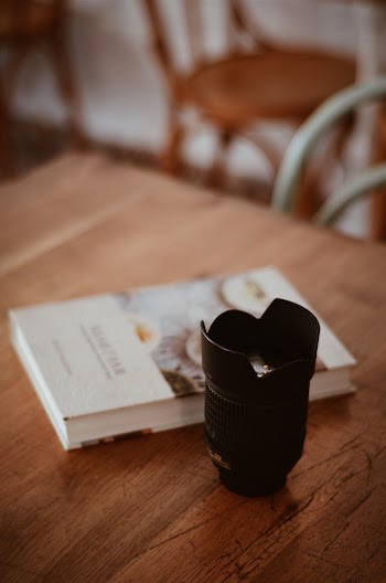 Black Camera Zoom Lens on Table