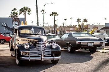 black car beside car during daytime
