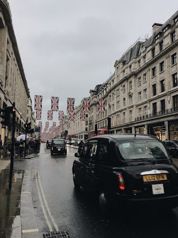 Black Car on Road Near Buildings
