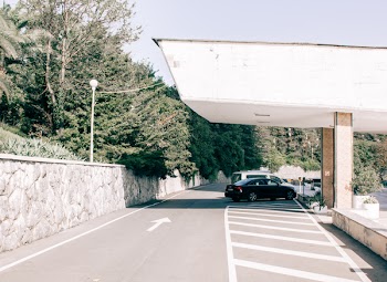 Black Car Parked on Gray Pavement