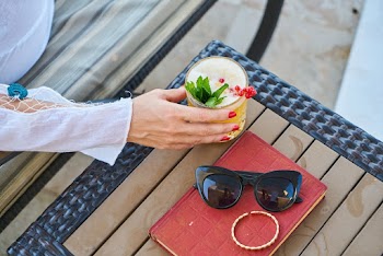 Black Cat's-eye Sunglasses Besides Silver-colored Bangle