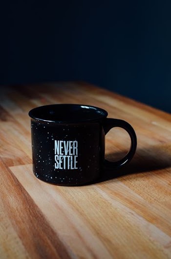 black ceramic mug on table