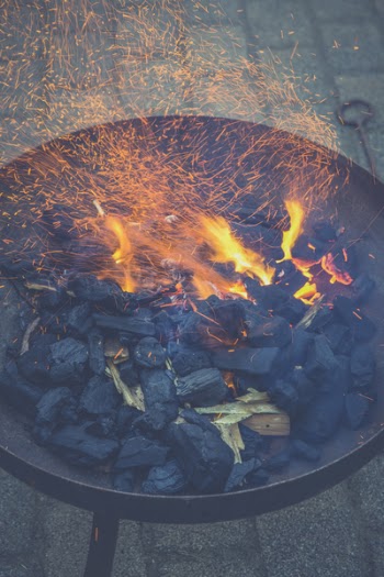 Black Charcoal With Fire on Black Round Steel Bowl