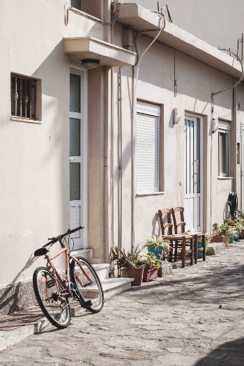 Black City Bike Parked Beside White Concrete Building