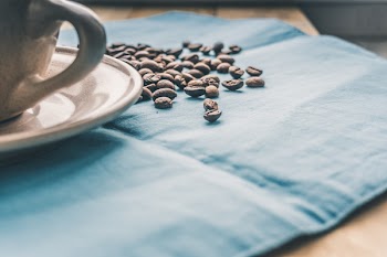 Black Coffee Beans on Blue Textile