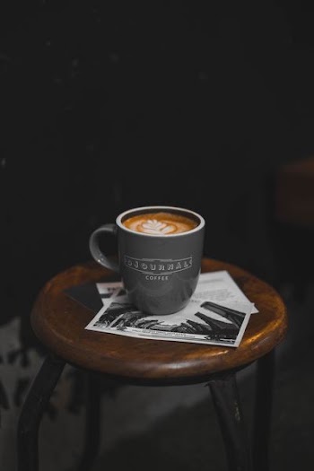 black coffee mug filed with espresso coffee