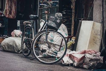 Black Commuter Bike Beside Trash