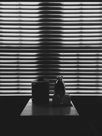 black container and pitcher on top of table