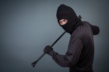 Black criminals wore a head yarn on gray Free Photo