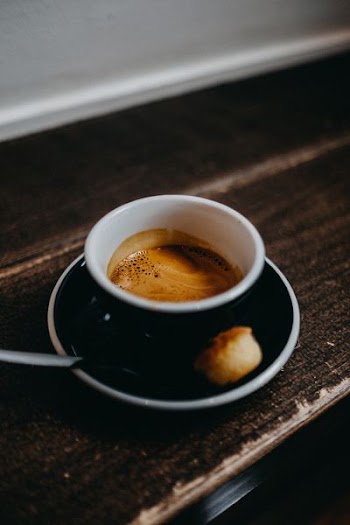 black cup filled with coffee