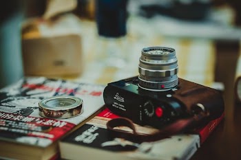 black digital camera on red book