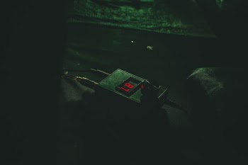 black digital device with the number 87