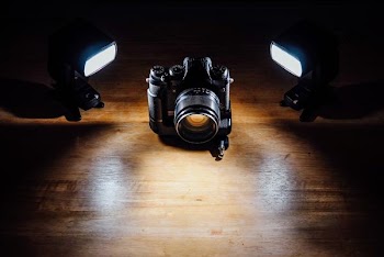 black DSLR camera in dark room
