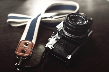 Black Dslr Camera With Leash