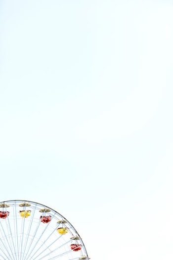 black ferris wheel under clear skies