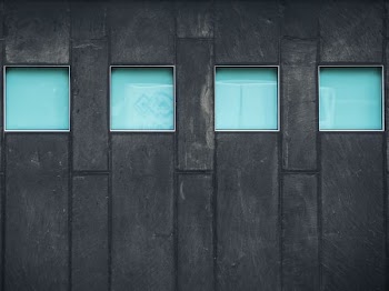 black framed 4-glass panel wall
