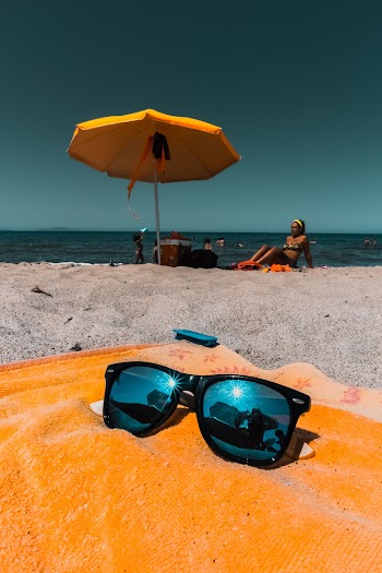 Black-framed Blue Sunglasses on Orange Textile