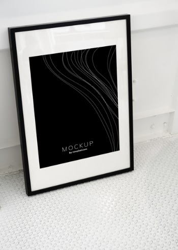 Black Framed Mockup Poster Leaning on White Wall