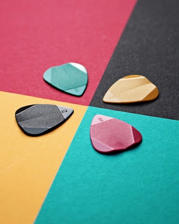 Black, Green, Yellow, and Red Guitar Pics