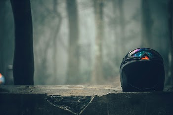 Black Half-faced Helmet on Gray Concrete Wall