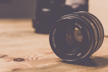 Black Helios 44m 2/58 Camera Lens on Brown Wooden Table