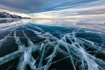 Black ice. Lake Baikal in winter, Russia.